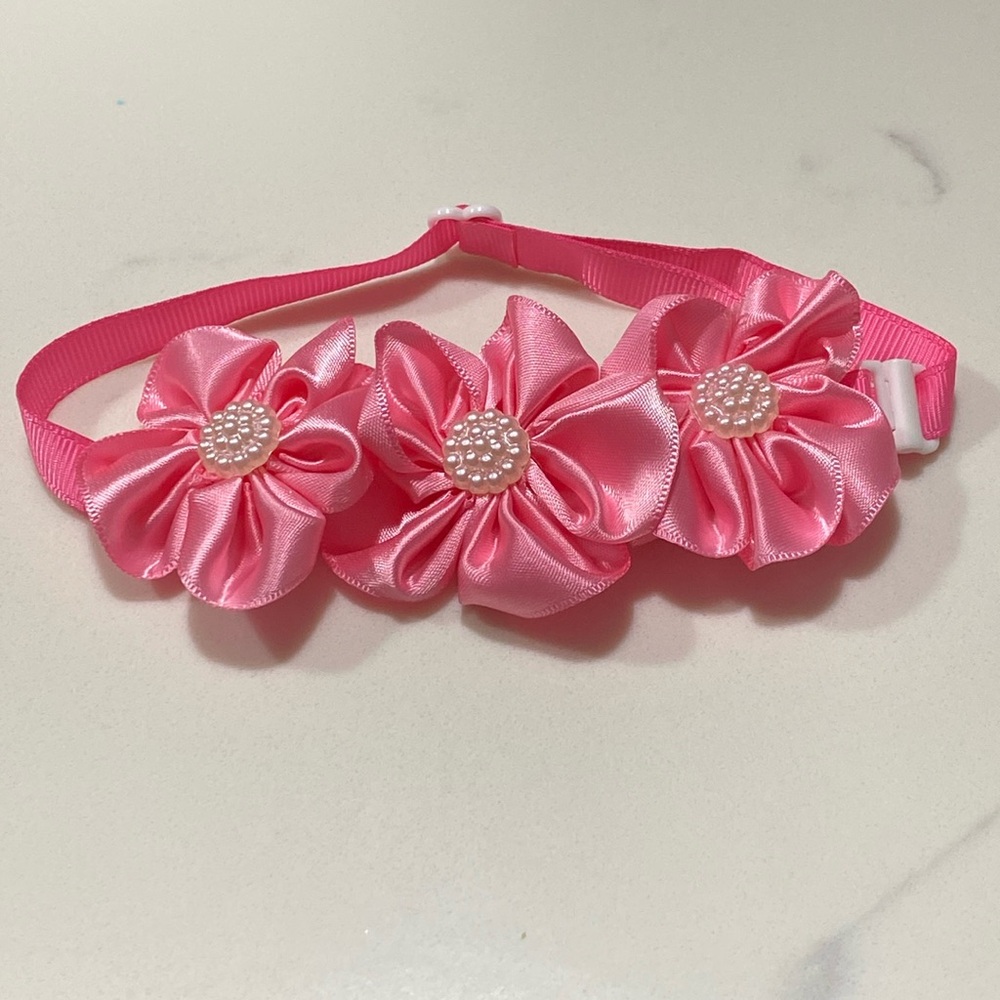 A Valentine’s Day adjustable dog collar - pink flowers with white bead center